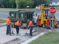 A group of men working on a street project.