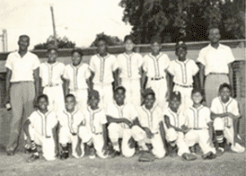 A black and white photo of a youth baseball team.