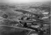 A black and white aerial photo of a facility.