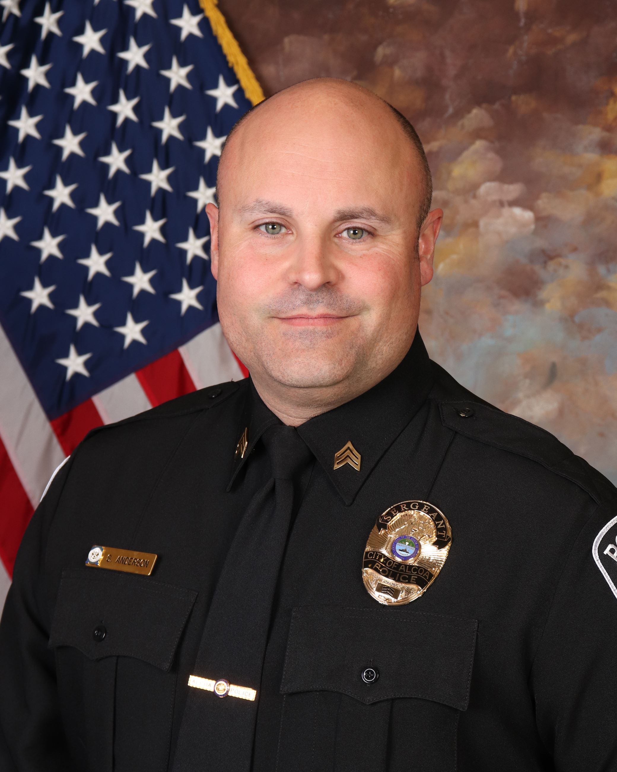 Caldwell, Matt uniformed in front of US flag