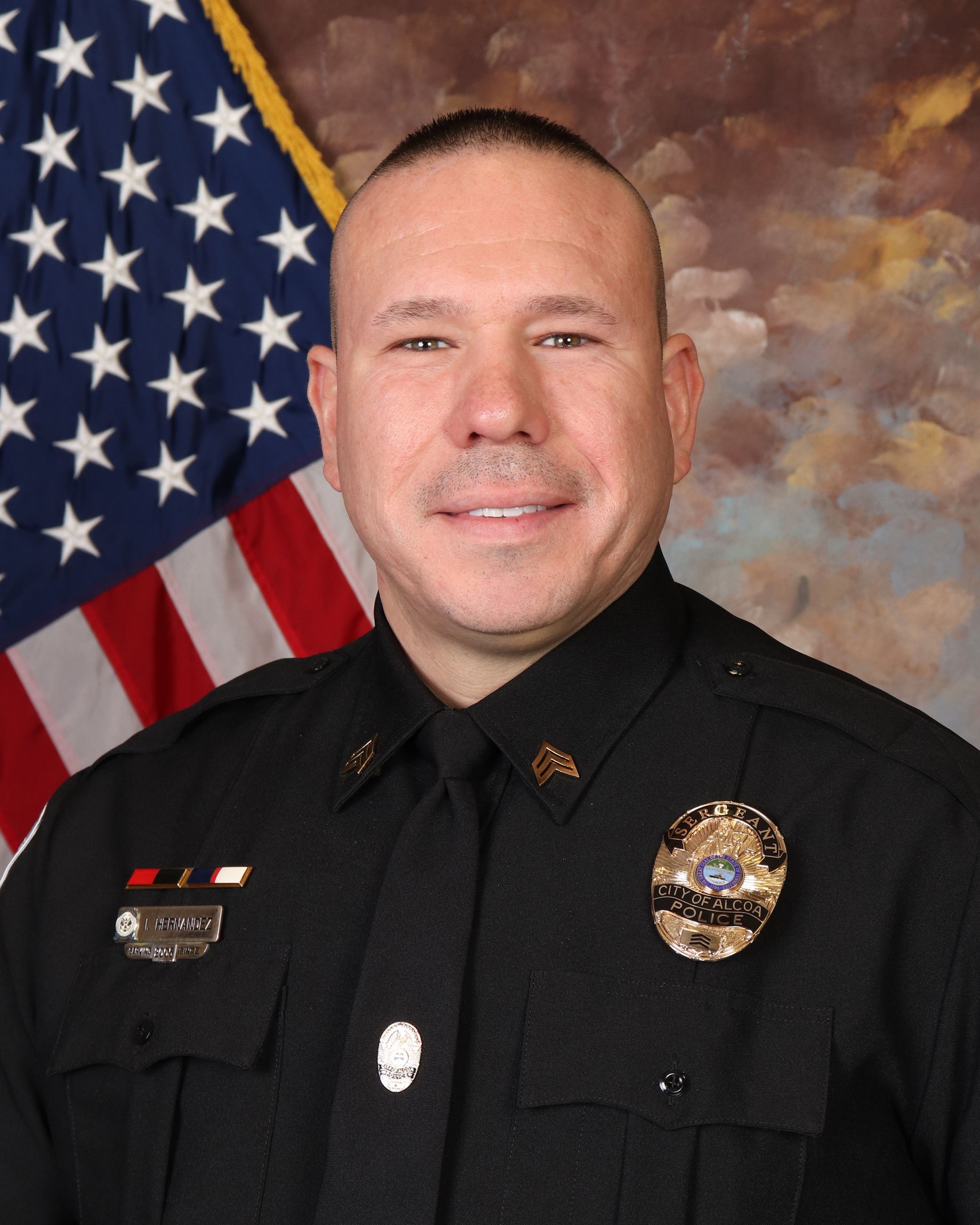 Hernandez, Israel uniformed in front of US flag